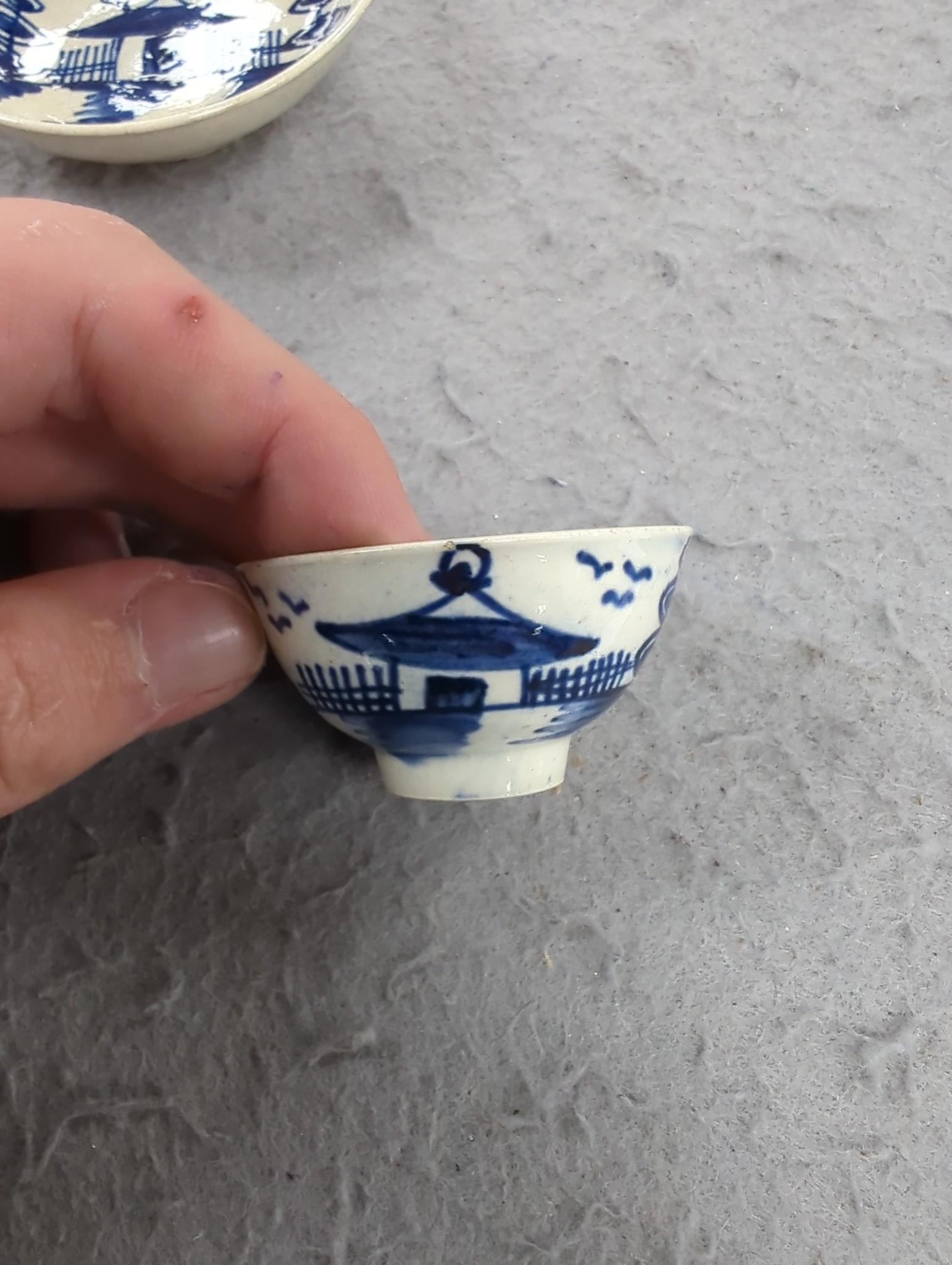 A late 18th century pearlware blue and white miniature jug, 5cm, and tea bowl and an English porcelain miniature mug, late 18th century